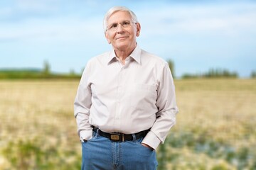 Portrait of a happy senior man posing outdoors