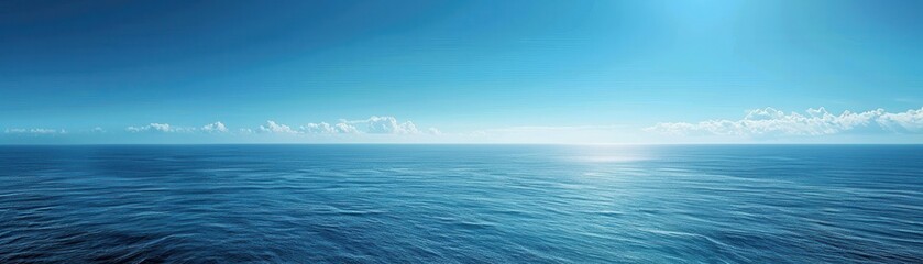 Fototapeta premium The ocean is calm and blue, with a clear sky above