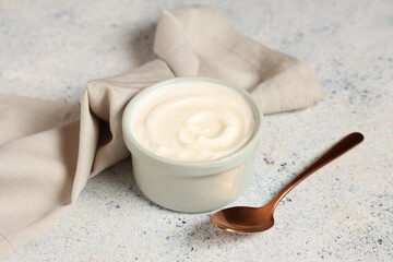 Bowl of tasty yogurt on white background