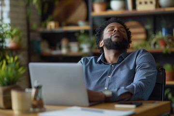 Obraz premium Overworked African American Office Worker Sleeping at Desk