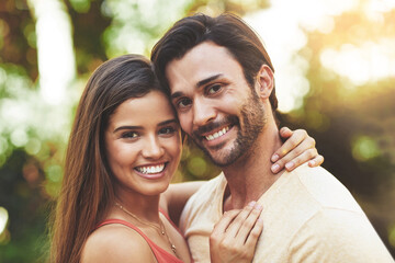 Naklejka premium Couple, happy and outdoor portrait with love for relationship trust, embrace and bonding together. Face smile, man and woman in nature for partnership hug, support and honeymoon vacation in Colombia
