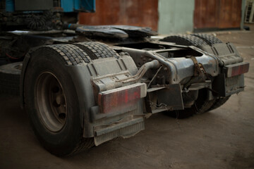 Rear wheels of trucks. Truck in parking lot. Machine without trailer.