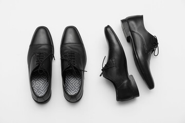 Stylish male leather shoes on grey background