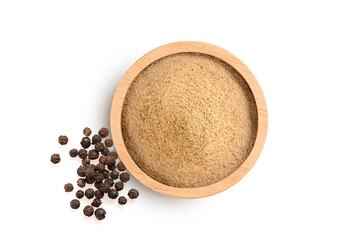 Ground peppers in a wooden bowl and pepper isolated on white background. top view