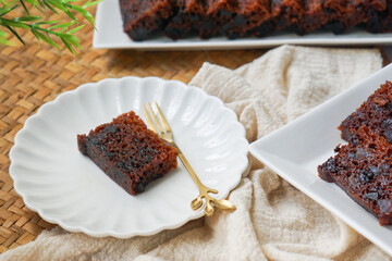 Kek Buah Kukus, a traditional Malaysian steamed fruit cake filled with dried fruits, nuts, and spices
