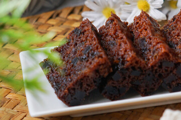 Kek Buah Kukus, a traditional Malaysian steamed fruit cake filled with dried fruits, nuts, and spices