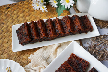 Kek Buah Kukus, a traditional Malaysian steamed fruit cake filled with dried fruits, nuts, and spices