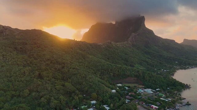 Dramatic sunset over Mount Otemanu on the tropical island of Bora Bora in French Polynesia. Aerial footage captued by drone. 