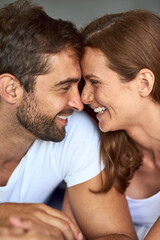 Happy couple, love and laughing in morning, peace or support for marriage commitment at house. Wake...