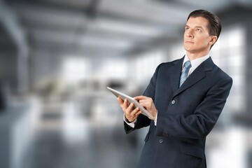 Fototapeta premium Happy smart businessman working in office