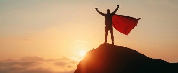 A person in a superhero cape striking a heroic pose on a hill