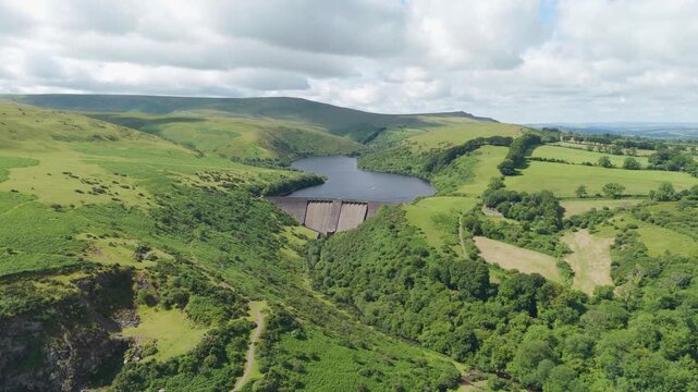 Aerial fly-in of Meldon Reservoir offering sweeping views over Okement Valley in Dartmoor National Park