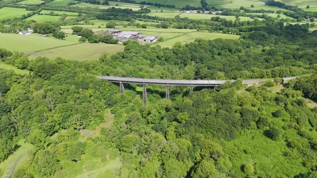Aerial view of Meldon Viaduct, a disused railway bridge crossing West Okement River, now a pedestrian pathway