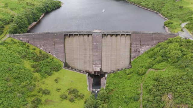 Aerial view of Meldon Reservoir surrounded by lush greenery in Dartmoor National Park, UK