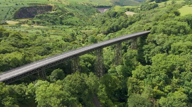 Aerial fly-in of Meldon Viaduct and Okement Valley, highlighting the bridge and surrounding landscape