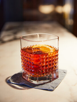 Negroni cocktail over a marble surface.