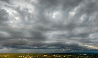 Heavy rain falling down from stormy clouds during thunderstorm on dark sky. Moving and changing cloudscape weather