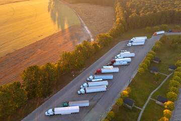 Truck stop at state welcome center near busy American interstate freeway. Parking for semi-trucks...