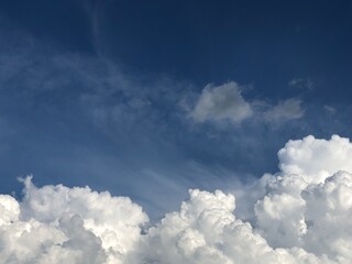 Fototapeta premium Fluffy White Clouds on Blue Sky Background