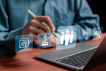 HR, human resources management technology concept. HR manager checks the CV online to choose the...