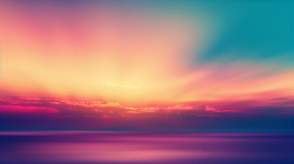 Obraz premium A dreamy and beautiful pink sunset painting the sea and sky, with the sun setting behind red-tinted clouds.