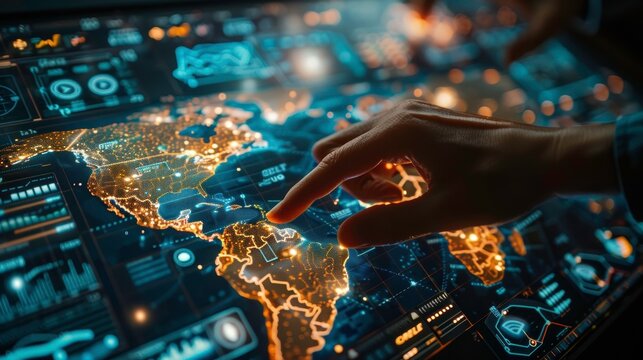 A close-up of a hand interacting with a digital map interface, showcasing illuminated regions and data overlay.