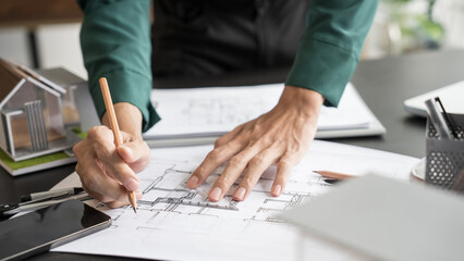 Architecture Man drawing on architectural Creative project business architecture building construction Industrial engineering Achievement Planning Design on eco blueprint