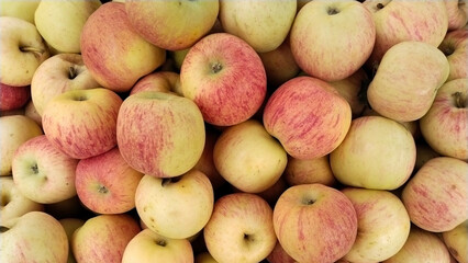 Apples background, fresh fruits on wood table, top view