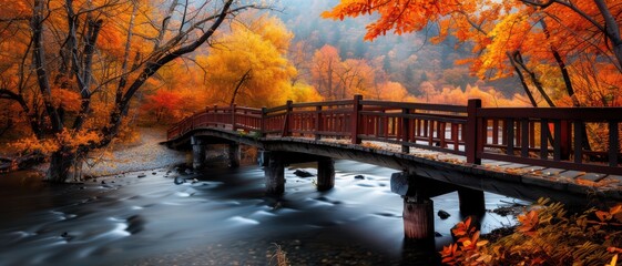 Serene Autumn Landscape with Wooden Bridge Over Flowing River and Vibrant Foliage