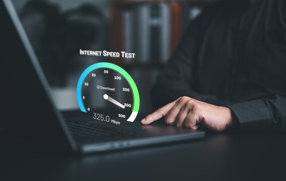 Fast internet network connection speed test. Man using a laptop computer to check bandwidth of wireless networking or 5G cellular Mbps or Gbps speed quality. Wi-Fi 7 download or upload transfer rate.