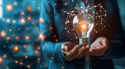 Businessman holding creative light bulb with growth graph and knowledge management system icons. Utilizing innovation technology to develop new strategies and solutions that enhance successful