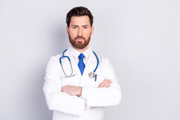 Fototapeta premium Photo of professional qualified doctor crossed arms empty space wear white coat isolated on grey color background