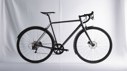 Fototapeta premium Close-up of a sleek black road bicycle with a modern design displayed on a white background