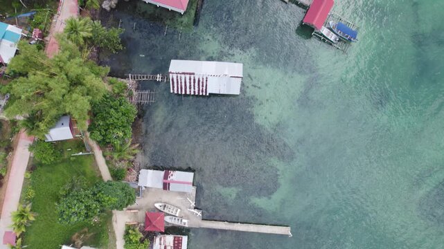 Aerial birds eye view showcasing the rooftops and waterfront structures of Bastimentos Island in Bocas del Toro District, Panama.