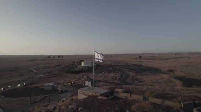 The flag symbolizing Israel's war is in the Golan Heights on the Tel Saki bunker that was used in the war, the site of one of the most critical battles of the Yom Kippur War on 1973 (D-log)
