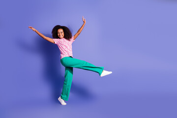 Fototapeta premium Full size photo of pretty young girl dancing have fun wear trendy pink outfit isolated on purple color background