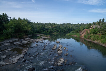 A river flowing between rocks in the tropical forests of Indonesia