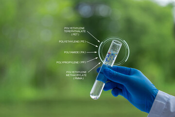 A scientist holding a test tube full of microplastics collected from the Sea. Water pollution and industrial waste management. plastic pollution. global warming.Microplastics composition infographics. © Pcess609