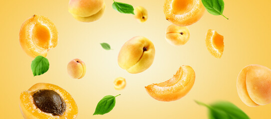 apricots group, slices and leaves flying on apricot colour background. Reference for design.