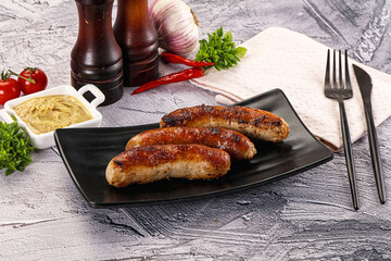 Delicous natural roasted sausages in the plate