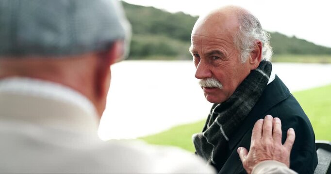 Discussion, senior men and park with support from grief, sad story and cancer news outdoor. Reunion, retirement and empathy of elderly friends by a lake with communication and kindness of friendship