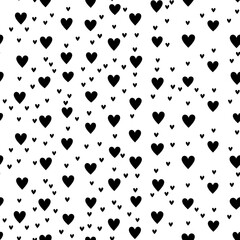 Fototapeta premium A seamless pattern featuring small black hearts on a white background. Ideal for Valentine's Day designs, romantic themes, and cute backgrounds
