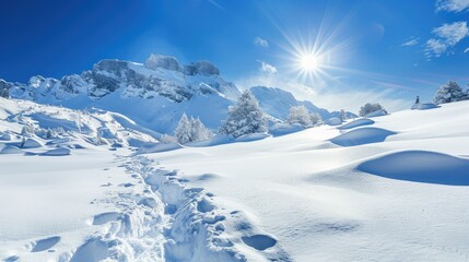 A snow-covered mountain landscape with a bright blue sky.