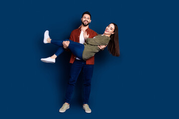 Photo of cheerful happy lovely couple wife husband wear family outfit isolated on dark blue color...