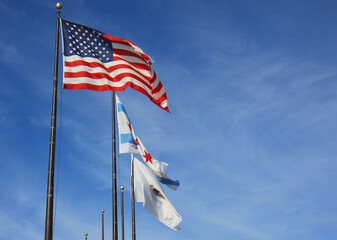 American Flag, Illinois Flag and Chicago Flag  flying in the Air in Chicago, Illinois, USA