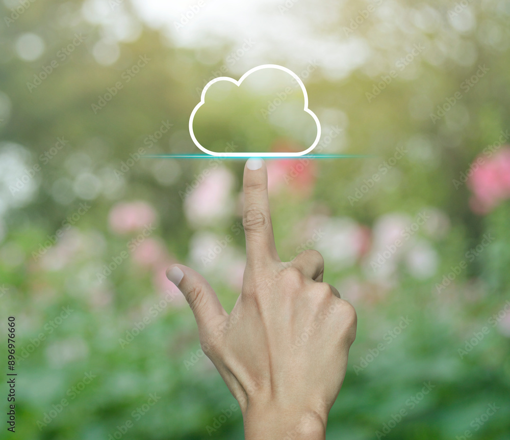 Poster hand click on cloud computing icon with copy space over blur pink flower and tree in park, technolog