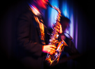 Abstract motion blurred image of a jazz saxaphonist on stage