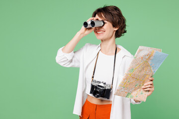 Traveler shocked amazed woman wear casual clothes read map use binocular look aside isolated on...