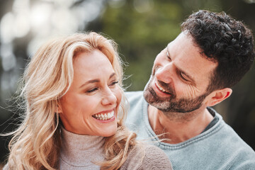 Fototapeta premium Couple, relax and hug for outdoor laughter, love and affection for spouse on holiday. Mature people, funny humor and vacation for bonding on travel, embrace and countryside security in commitment