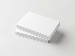 A set of four crisp white business cards neatly stacked on a clean and minimal background. This packaging suggests professionalism and is ready for use.
